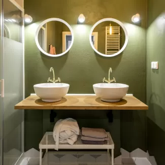 Cosy LED spotlights in green bathroom